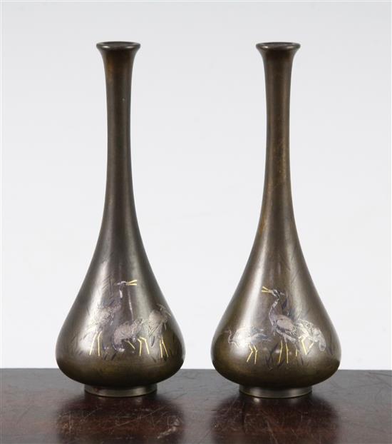 A pair of Japanese silver and gold inlaid bronze small bottle vases, Meiji period, 14cm